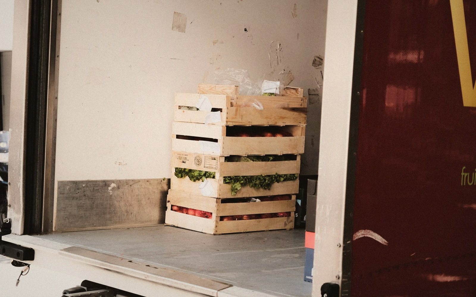 An open art crate with foam and a wrapped work inside