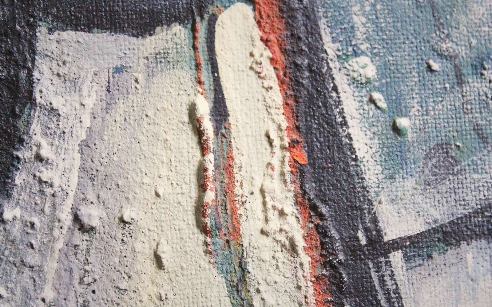 Close-up of thick impasto paint with raised ridges of white, orange and grey pigment